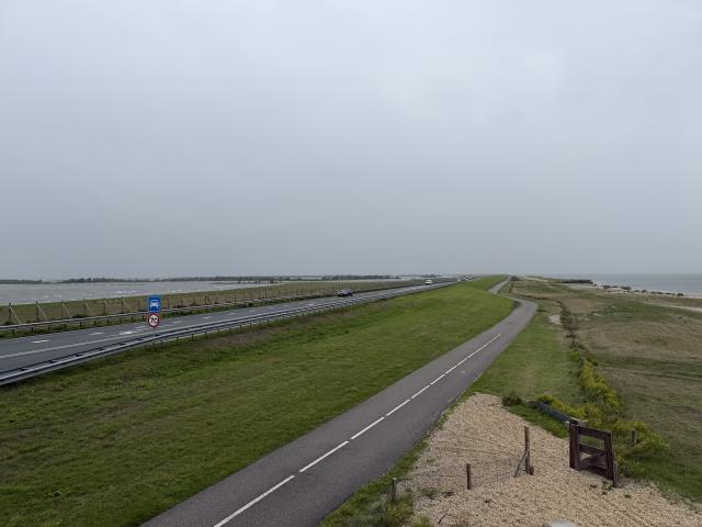 A two lane motorway that disappears into the horizon with just water on both sides